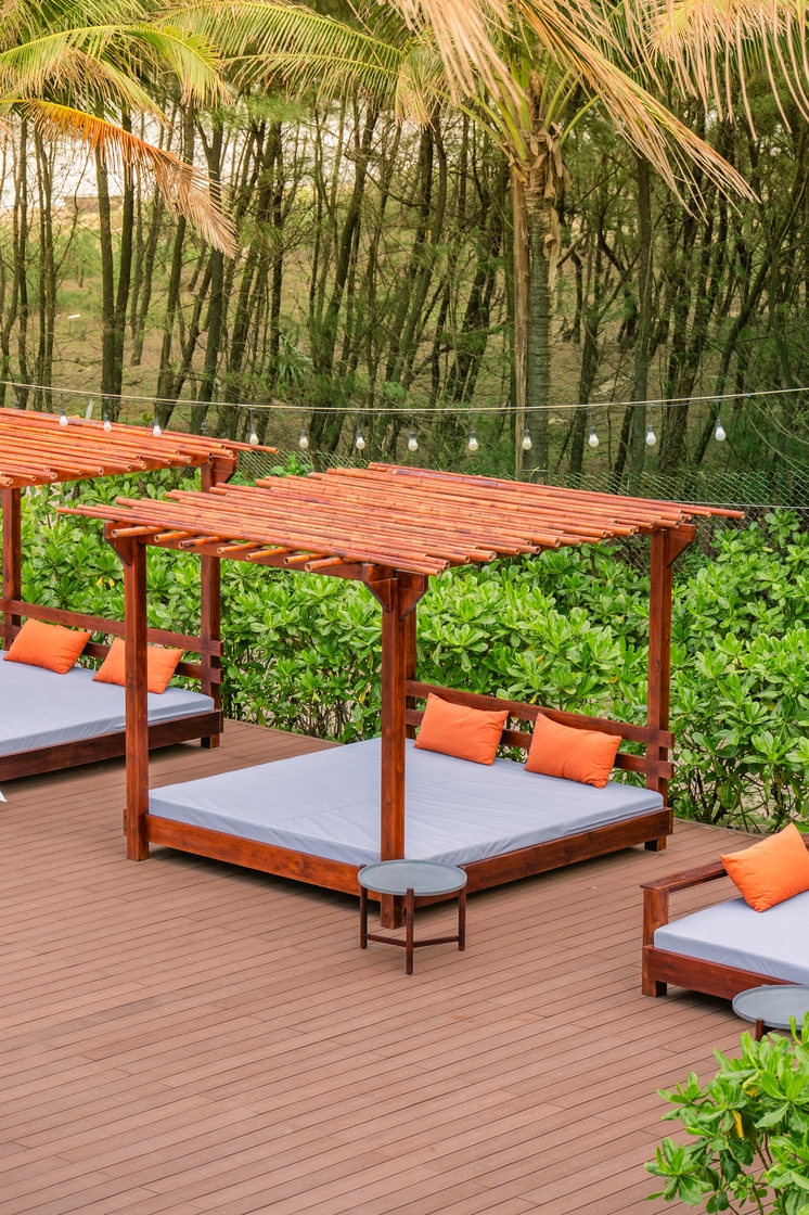 Outdoor leisure area at Blush Beach Club with stunning coastal views and sophisticated ambiance